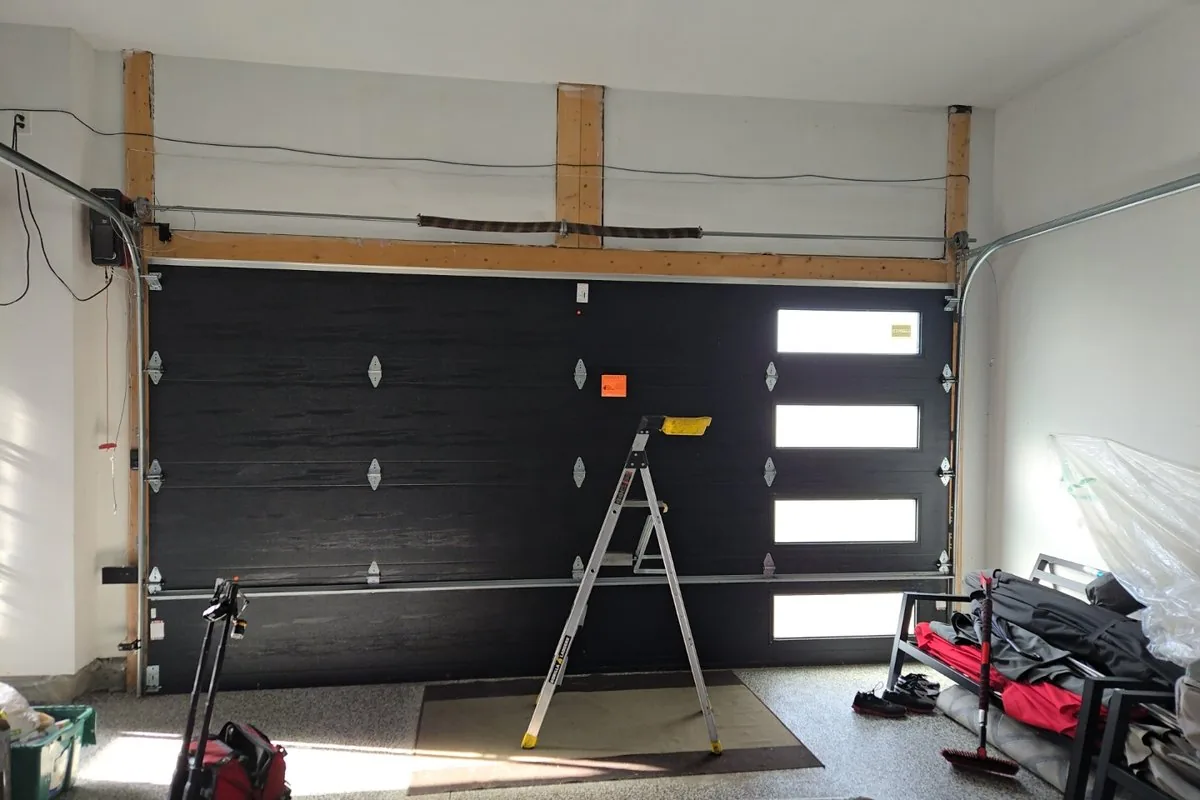 Modern Avalon home in south Orléans with a contemporary black insulated double garage door