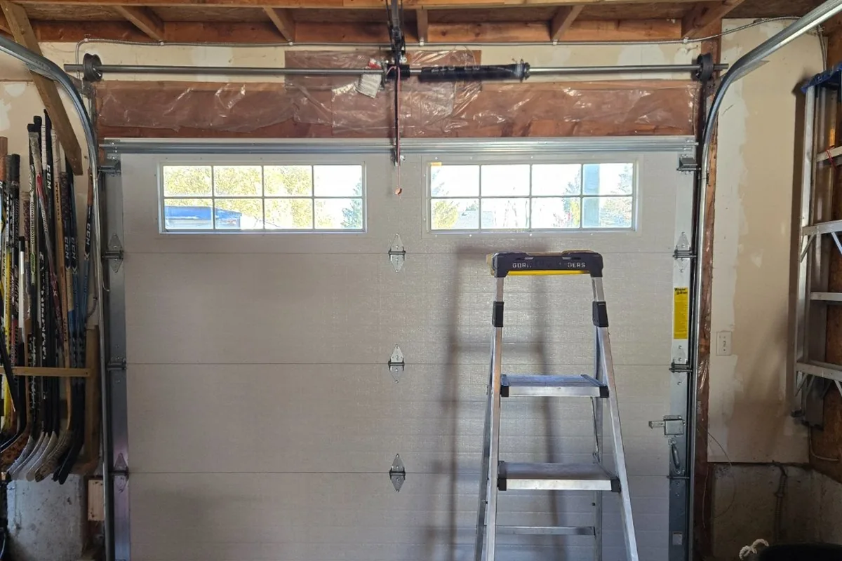 Modern LiftMaster Wi-Fi garage door opener installed on a finished ceiling